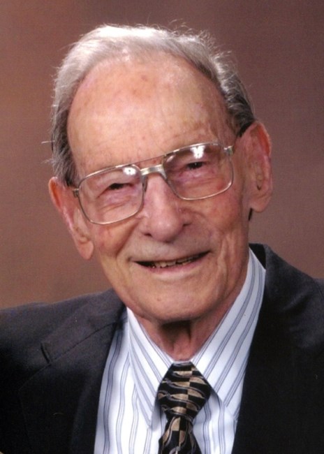 Obituary of Norman E. Mills