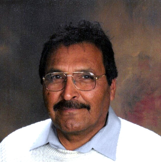 Obituary of Carlos E. Santa Cruz